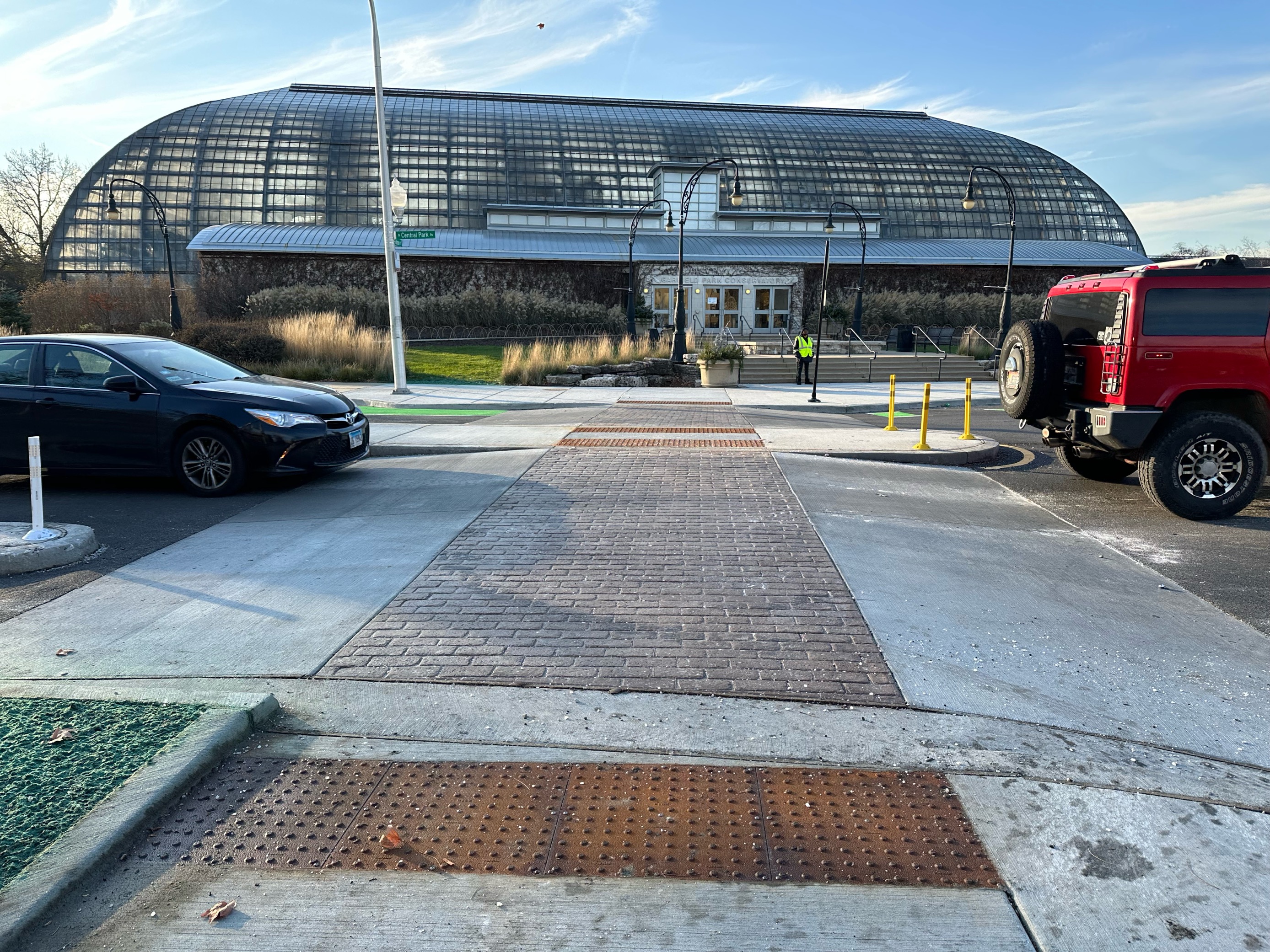 Photo of a raised crosswalk in front of the Garfield Park conservatory